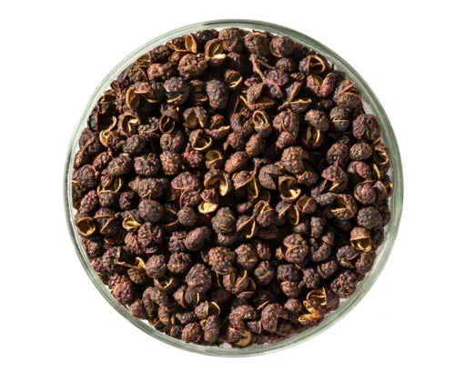 Glass bowl filled with whole PGI Kampot peppercorns from Spice n Slice Market