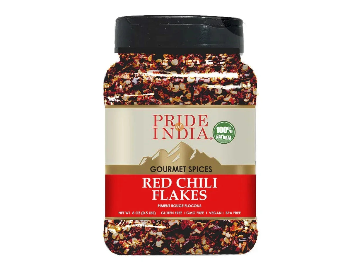 Jar of red chili flakes, labeled gourmet spices, on a white background