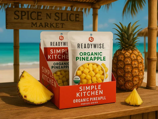 Freeze-dried organic pineapple snacks in tropical beach setting with fresh pineapple slices