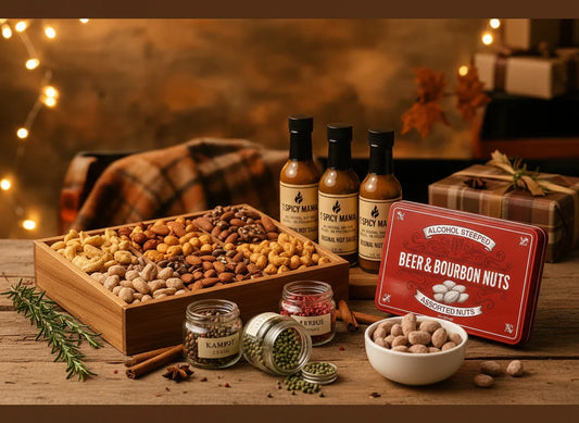 Gourmet food gifts with assorted nuts, spices, hot sauces, and gift box on rustic table