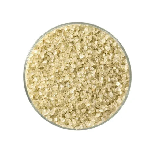 Close-up of natural bamboo jade sea salt crystals in a glass bowl