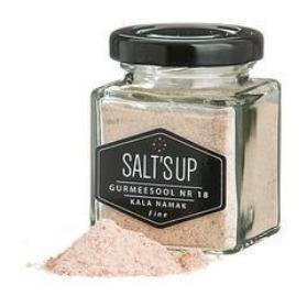 Salt's Up Kala Namak black salt in clear glass jar with black lid and salt pile, Spice n Slice Market