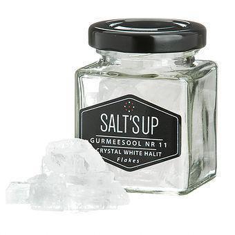 Crystal white halite salt flakes in a clear jar labeled Salt's Up, artisan seasoning at Spice n Slice Market