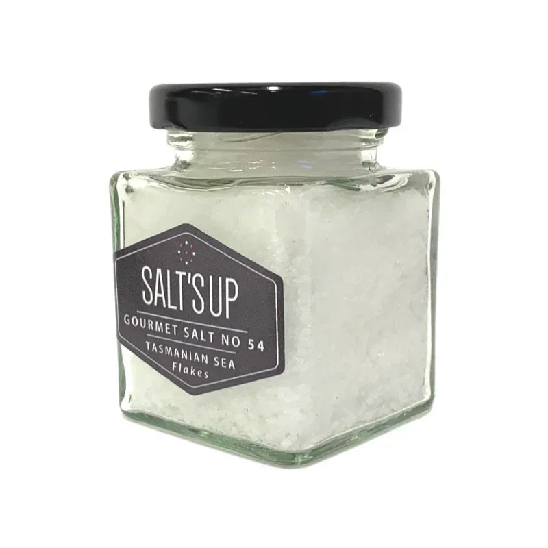 Jar of Tasmanian sea salt flakes with black lid and label, gourmet seasoning