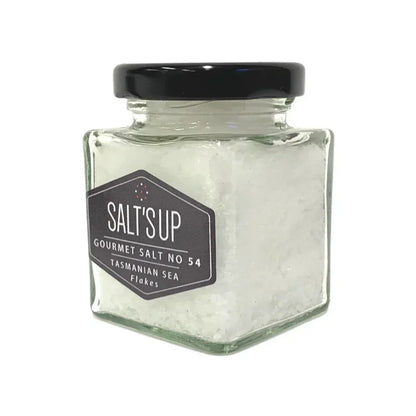 Jar of Tasmanian sea salt flakes with black lid and label, gourmet seasoning