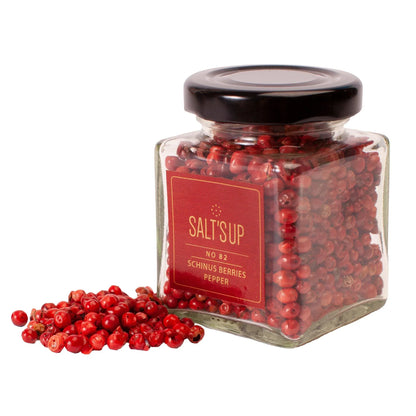 Glass jar of Schinus berries pepper with loose red peppercorns, Spice n Slice Market product