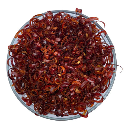 Glass bowl filled with artisan dried red chili pepper curls from Spice n Slice Market
