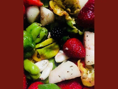 Colorful mix of fresh strawberries, blackberries, and organic dried fruits with herbs