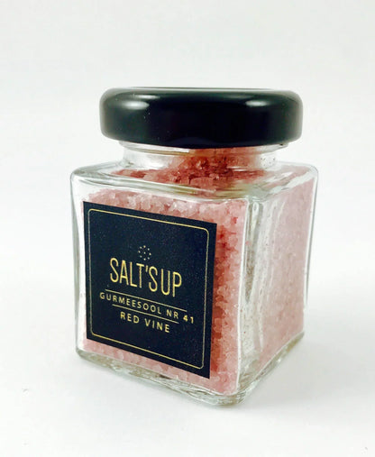 Jar of SALT'S UP Red Vine artisan gourmet salt, clear square glass with black lid, on white background