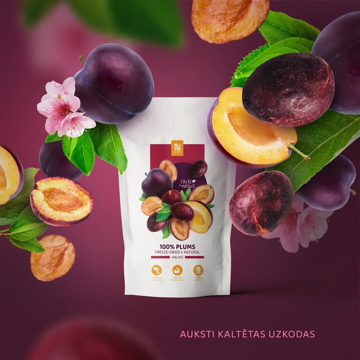 Freeze-dried plums in branded white packaging with fresh plums and leaves, Spice n Slice Market.