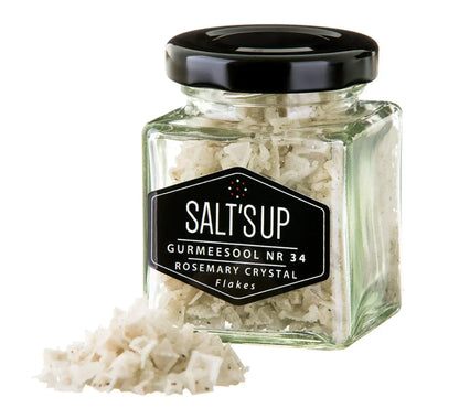 Square glass jar of Salt'sUp rosemary crystal flakes with salt pile, Spice n Slice Market gourmet seasoning