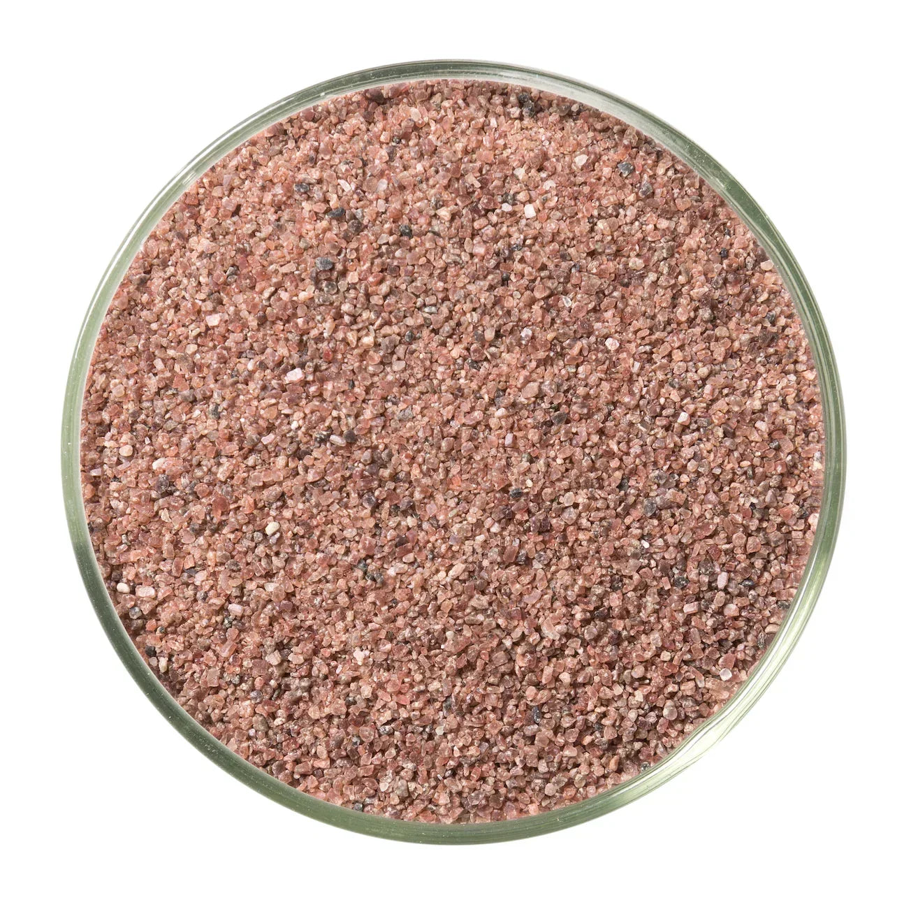 Close-up of pink Himalayan salt crystals in a glass bowl, coarse texture, gourmet seasoning