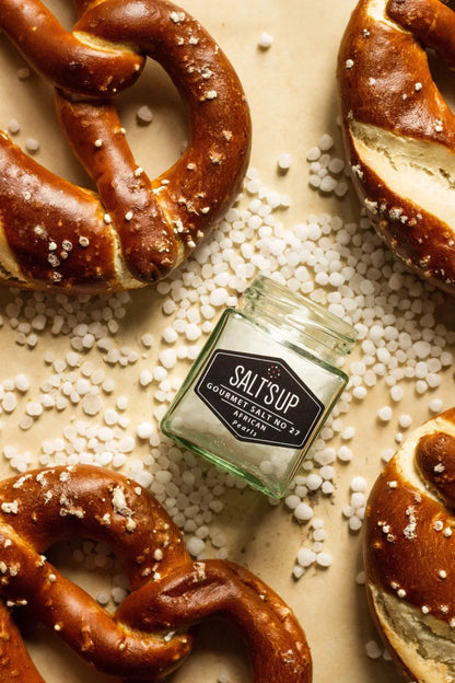Gourmet African pearl salt with salted pretzels on parchment, Spice n Slice Market