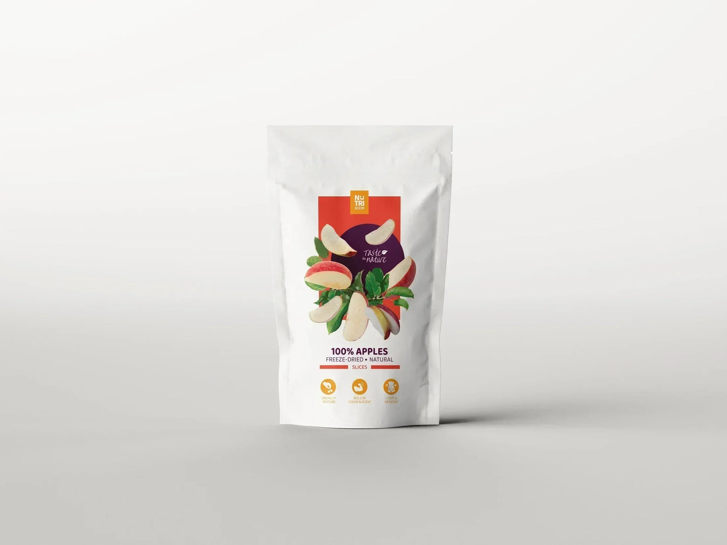 Bag of freeze-dried apples with apple slices and leaves on white packaging