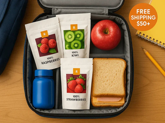 Lunchbox with dried raspberries, kiwi, strawberries, apple, sandwich, water bottle