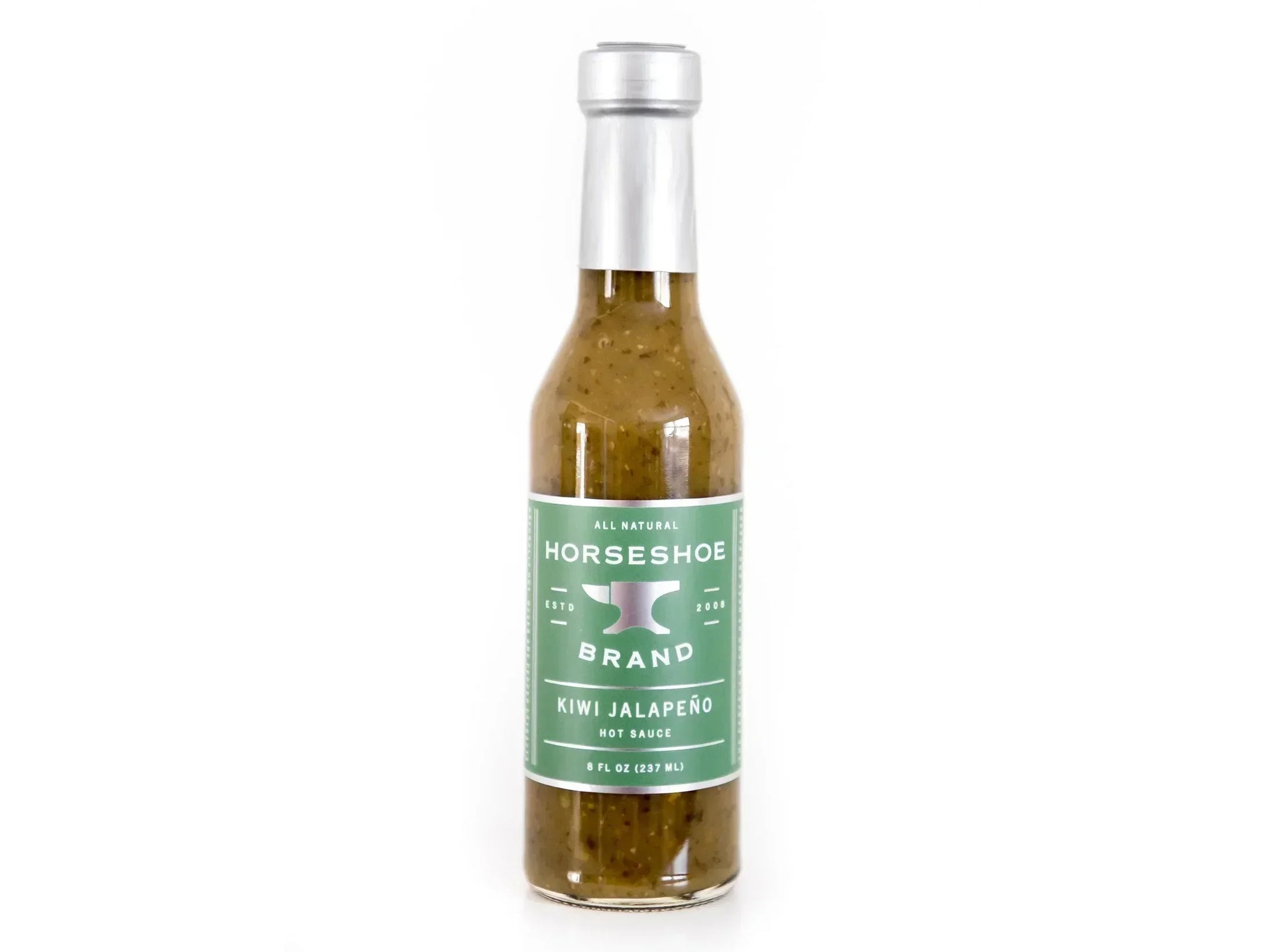 Glass bottle of kiwi jalapeño hot sauce with green label on white background