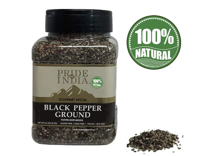 Jar of ground black pepper with 100% natural label and spice pile, gourmet seasoning