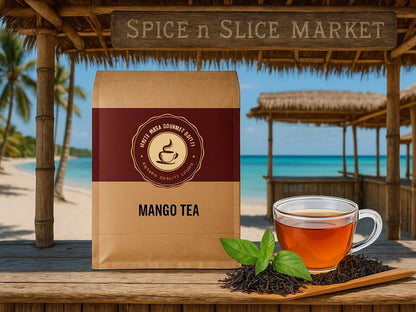 Mango tea package and glass cup with tea leaves on a tropical beach by the ocean.