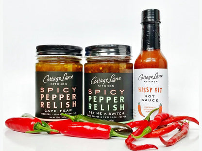 Three Cottage Lane Kitchen spicy pepper relishes and hot sauce jars with fresh red chili peppers