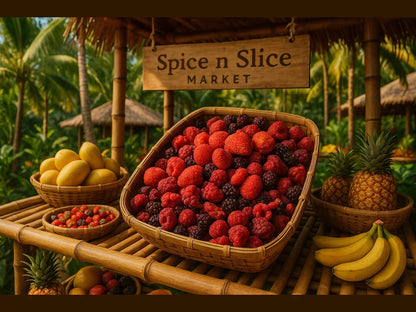 Basket of assorted organic berries, mangoes, bananas, pineapples at tropical fruit market stall