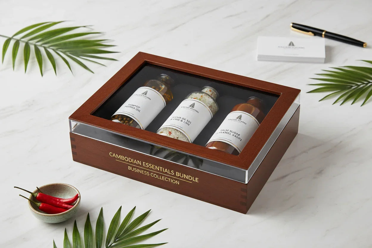 Cambodian Essentials Bundle gift box with chili oil, salt, and palm sugar sauce on marble table