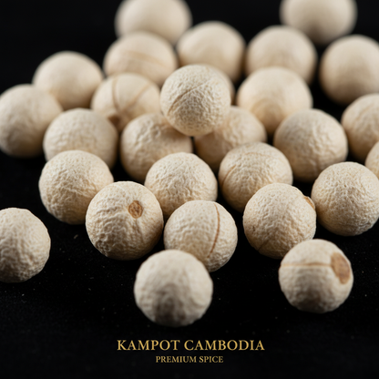 Long pepper white pearls macro close up pale ivory irregular peppercorns on black background