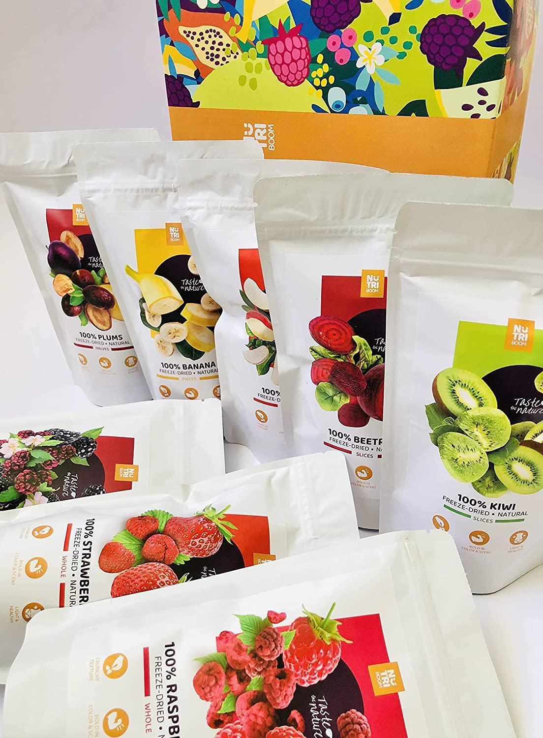 NutriBoom freeze-dried fruit and veggie snack packs with blackberries, kiwi, banana, apple, raspberries, strawberries, plums, and beetroot in a colorful Spice n Slice Market gift box.
