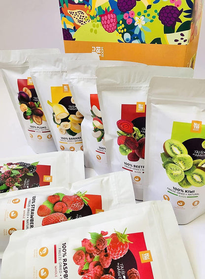 NutriBoom freeze-dried fruit and veggie snack packs with blackberries, kiwi, banana, apple, raspberries, strawberries, plums, and beetroot in a colorful Spice n Slice Market gift box.