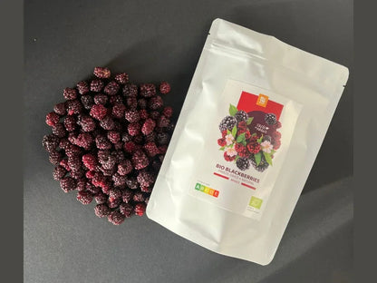 Freeze-dried organic blackberries next to a white resealable bag labeled bio blackberries