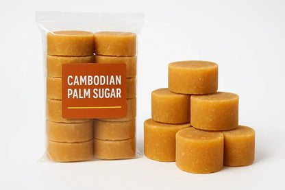Bulk Cambodian palm sugar discs in clear bag and stacked on white background