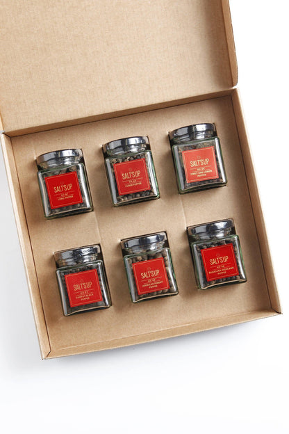 Gift box with six Salt'sUp branded pepper jars, including Kampot black pepper, in a kraft box