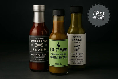Trio of artisan hot sauces in glass bottles on dark background with free shipping label.