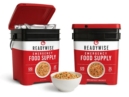 Two red and black ReadyWise emergency food supply buckets with a bowl of prepared food.